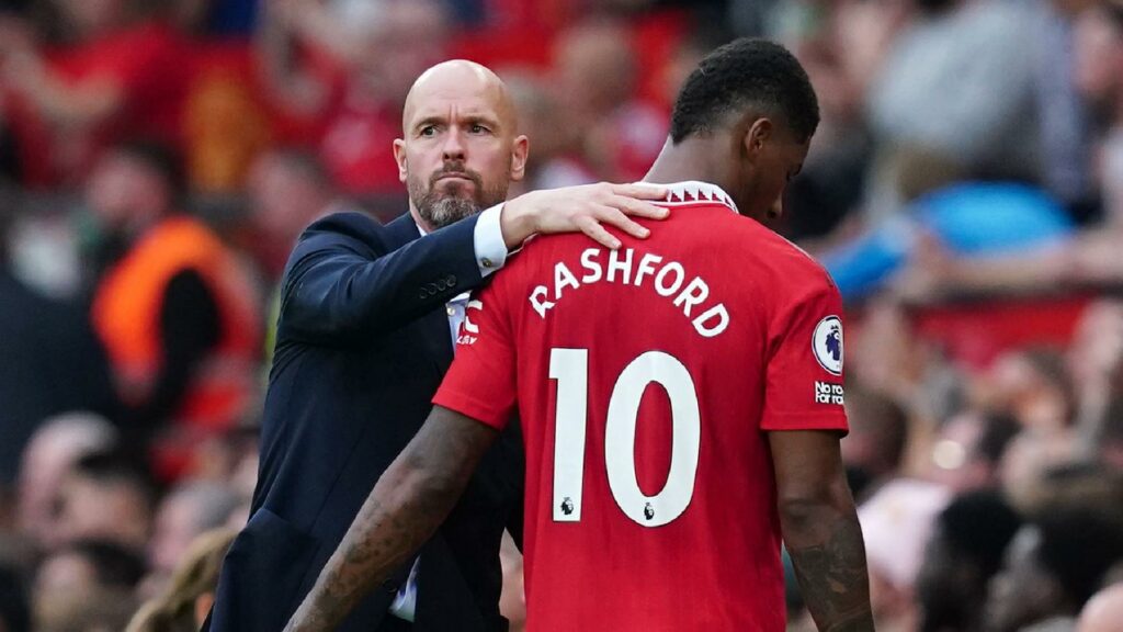 Erik ten Hag (left) puts a comforting arm onMarcus Rashford (Martin Rickett/PA Archive)