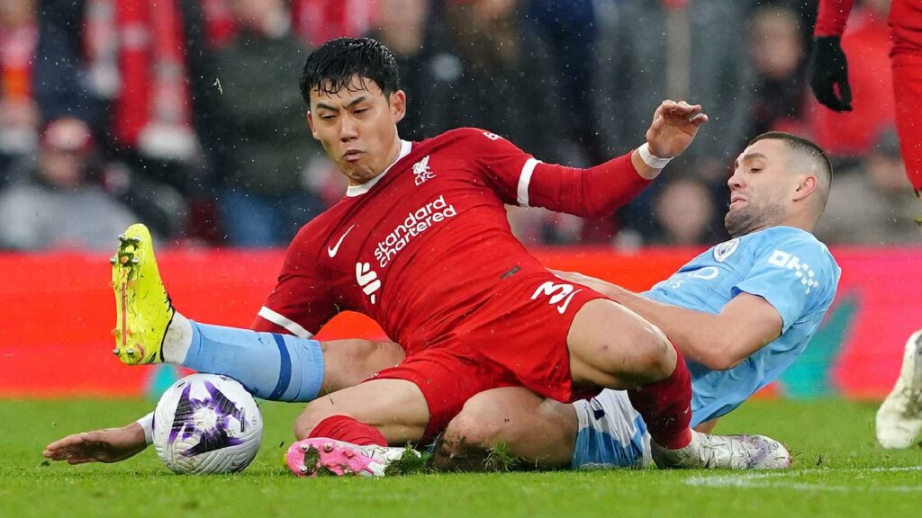 Liverpool’s Wataru Endo and Manchester City’s Mateo Kovacic (Peter Byrne/PA Wire)