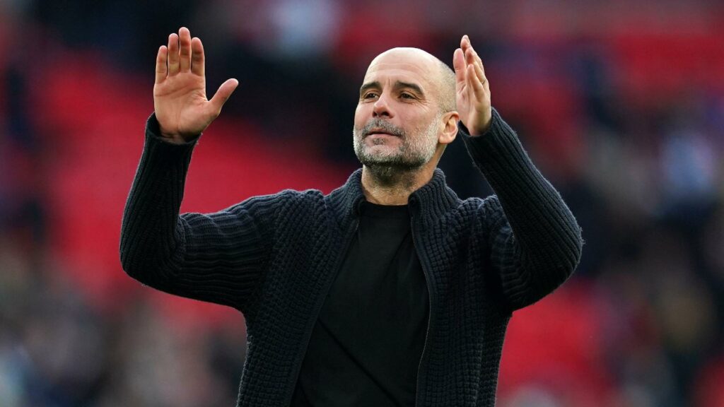 Pep Guardiola celebrates at Wembley (Adam Davy/PA Wire)
